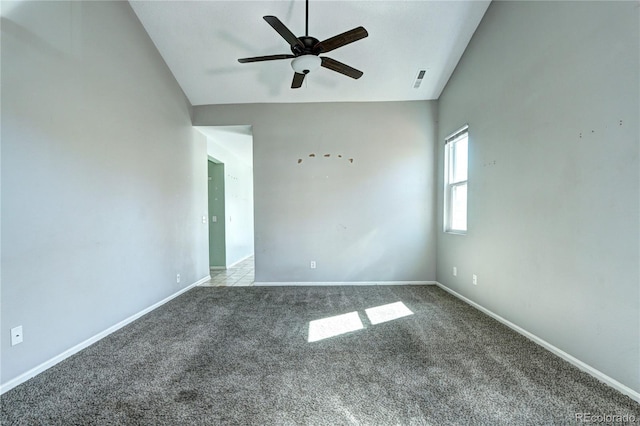 carpeted spare room with high vaulted ceiling, baseboards, and ceiling fan