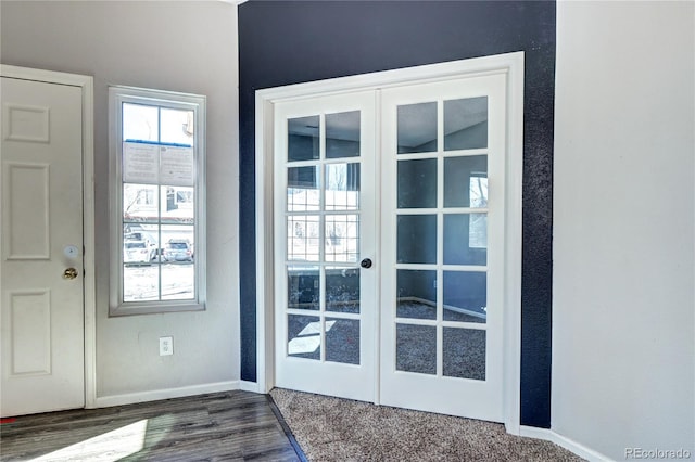 doorway featuring dark wood finished floors, french doors, and baseboards