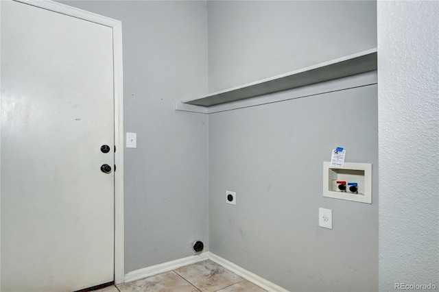 clothes washing area featuring light tile patterned floors, baseboards, hookup for an electric dryer, laundry area, and washer hookup