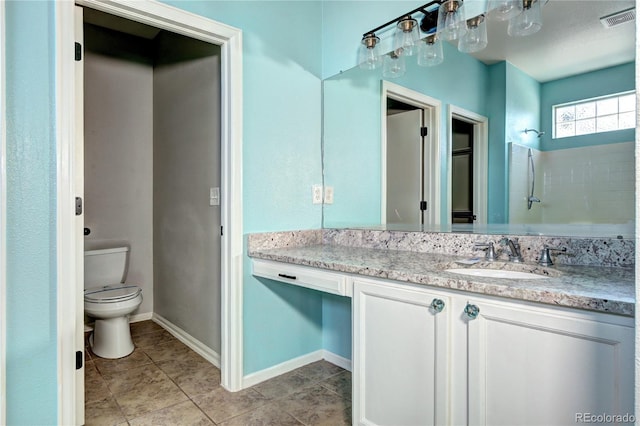 bathroom with visible vents, baseboards, toilet, tile patterned floors, and vanity