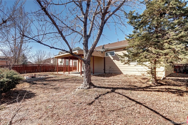 exterior space featuring a patio area and fence