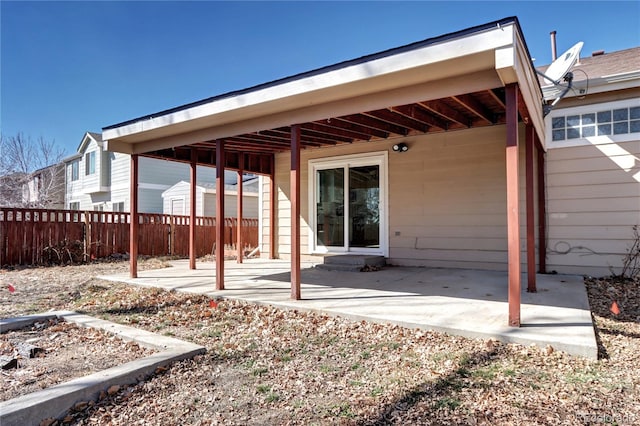 view of patio featuring fence