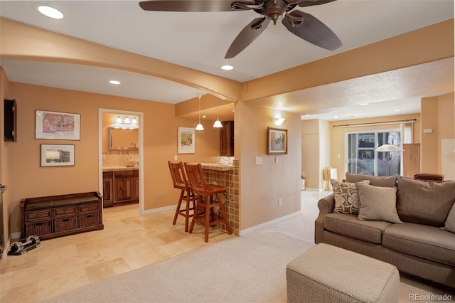 carpeted living room featuring bar