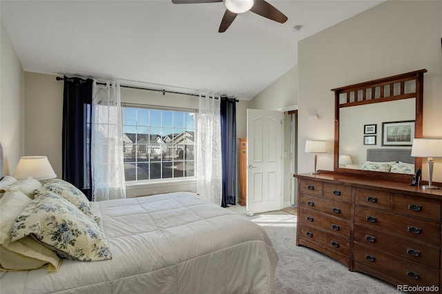 carpeted bedroom with ceiling fan and lofted ceiling