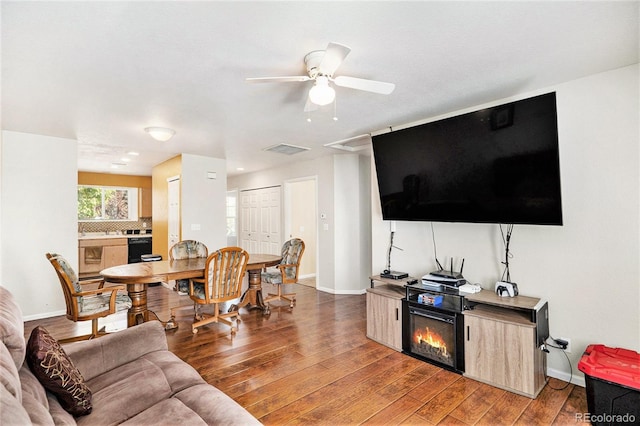 18786 E 57th Pl Unit A, Denver, CO 80249 - living room with light wood-style floors and a ceiling fan