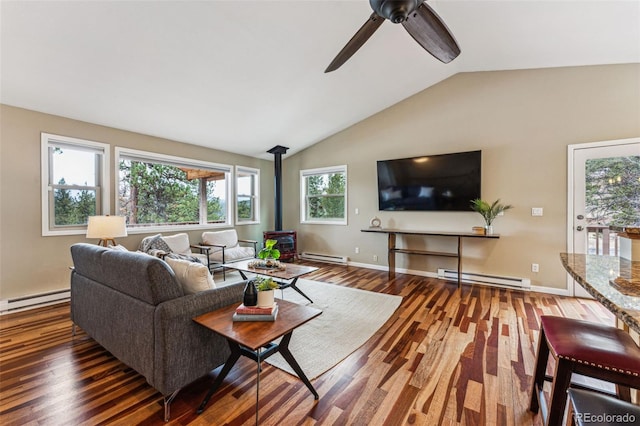 living room featuring a baseboard radiator, a wood stove, and wood finished floors