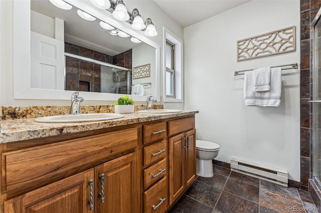 bathroom with baseboard heating, a sink, and a stall shower