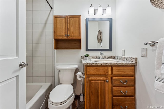 bathroom featuring toilet, bathtub / shower combination, and vanity