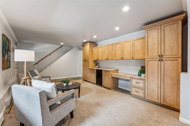 kitchen featuring light carpet, built in study area, light countertops, crown molding, and recessed lighting