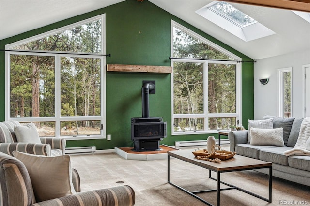 sunroom featuring a baseboard radiator, a healthy amount of sunlight, and vaulted ceiling with skylight