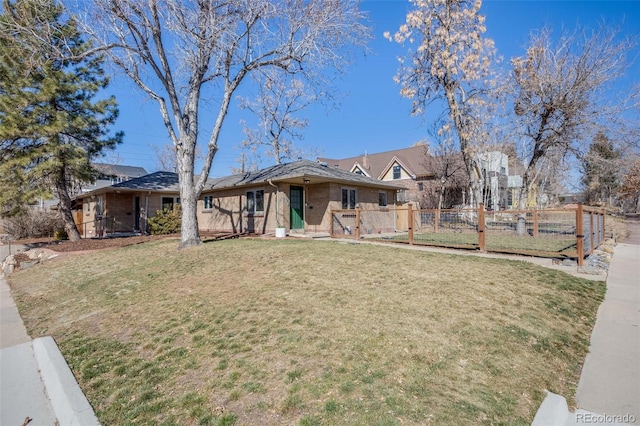 ranch-style home with brick siding, a front lawn, fence, and a gate