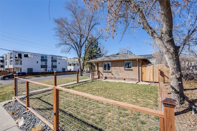 view of yard with fence and a gate