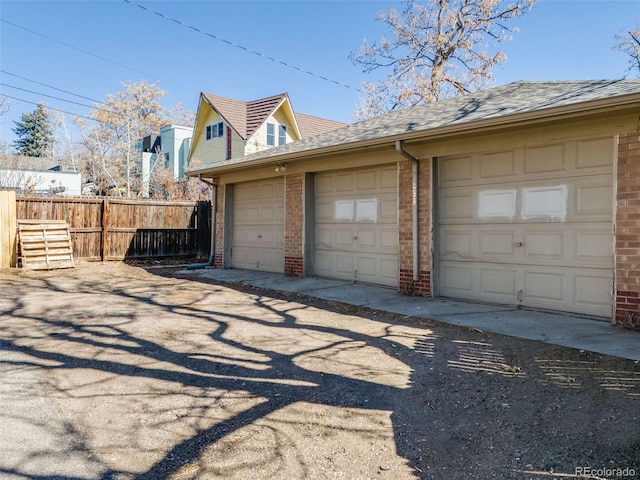 garage featuring fence