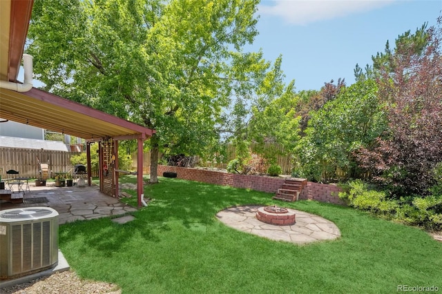 12941 S Princess Cir, Broomfield, CO 80020 - view of yard featuring a fire pit and a patio
