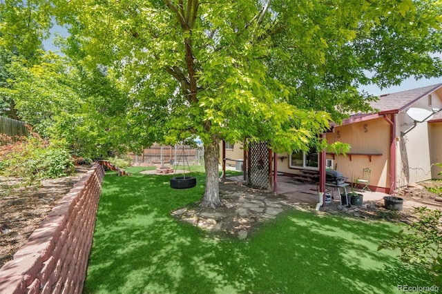 12941 S Princess Cir, Broomfield, CO 80020 - fenced backyard featuring a patio area and an outdoor fire pit