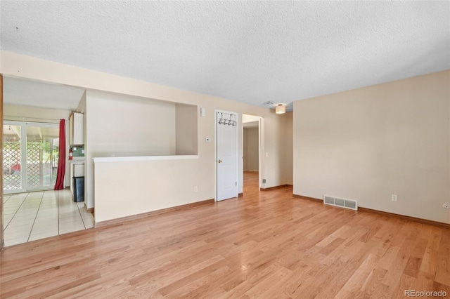 12941 S Princess Cir, Broomfield, CO 80020 - unfurnished room featuring wood finished floors and a textured ceiling