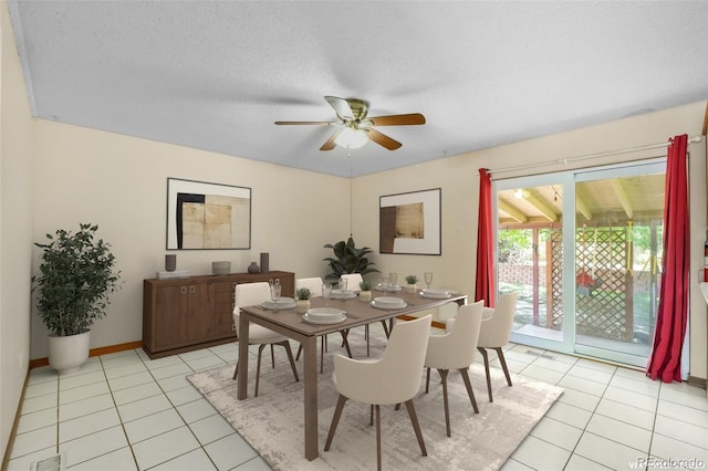 12941 S Princess Cir, Broomfield, CO 80020 - dining area featuring light tile patterned floors, a ceiling fan, and a textured ceiling