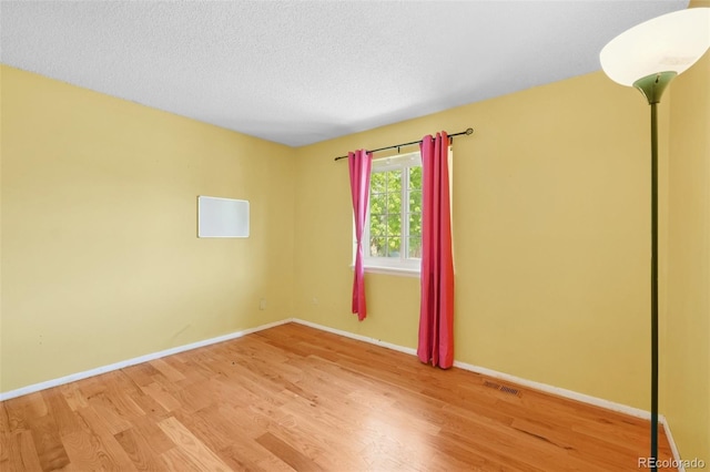 12941 S Princess Cir, Broomfield, CO 80020 - empty room with wood finished floors and a textured ceiling