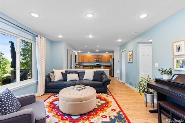 15963 Rock Crystal Dr, Parker, CO 80134 - living area with recessed lighting, light wood finished floors, and baseboards