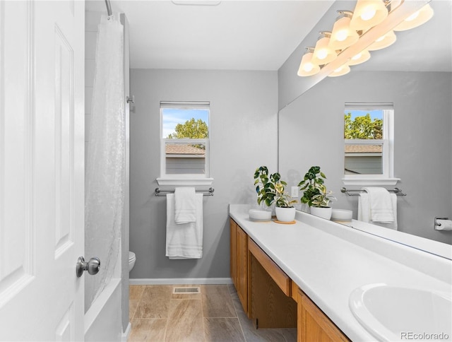 15963 Rock Crystal Dr, Parker, CO 80134 - full bathroom featuring vanity, healthy amount of natural light, toilet, and baseboards