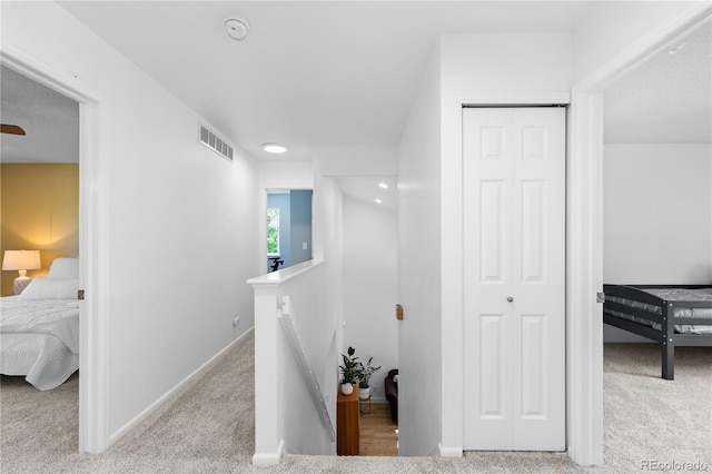 15963 Rock Crystal Dr, Parker, CO 80134 - hallway featuring an upstairs landing, carpet, and baseboards