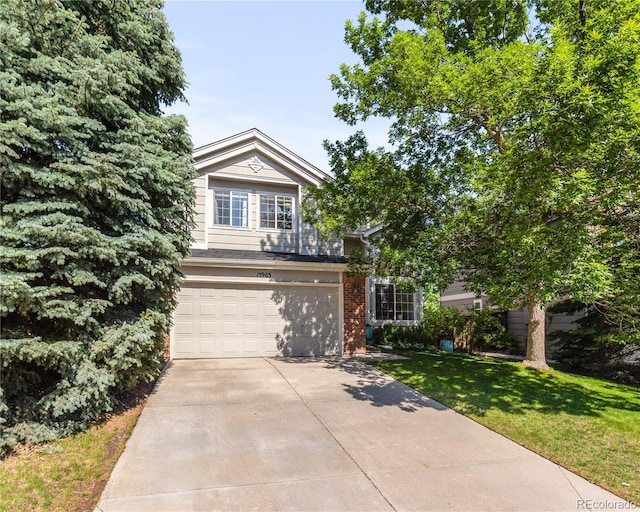 15963 Rock Crystal Dr, Parker, CO 80134 - view of property hidden behind natural elements with a garage, driveway, and a front lawn