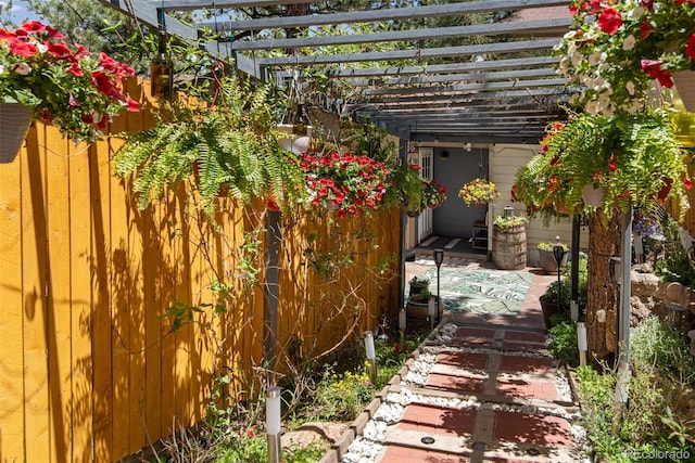 exterior space with a pergola and a patio area