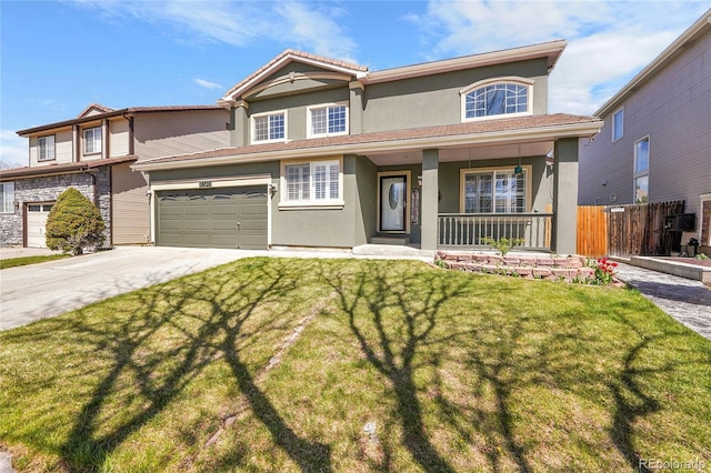 19731 E 40th Ave, Denver, CO 80249 - view of front of house with stucco siding, a porch, concrete driveway, and a garage
