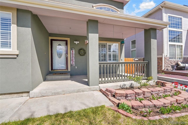 19731 E 40th Ave, Denver, CO 80249 - entrance to property with a porch, stucco siding, and stone siding
