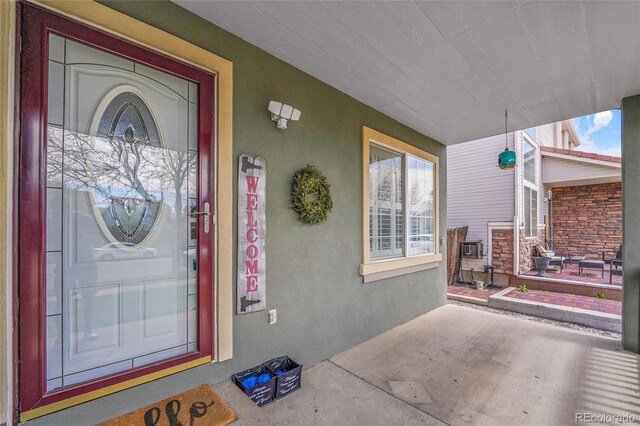 19731 E 40th Ave, Denver, CO 80249 - entrance to property with a porch and stucco siding
