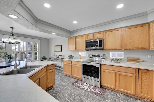 19731 E 40th Ave, Denver, CO 80249 - kitchen featuring stainless steel appliances, light countertops, recessed lighting, and decorative light fixtures