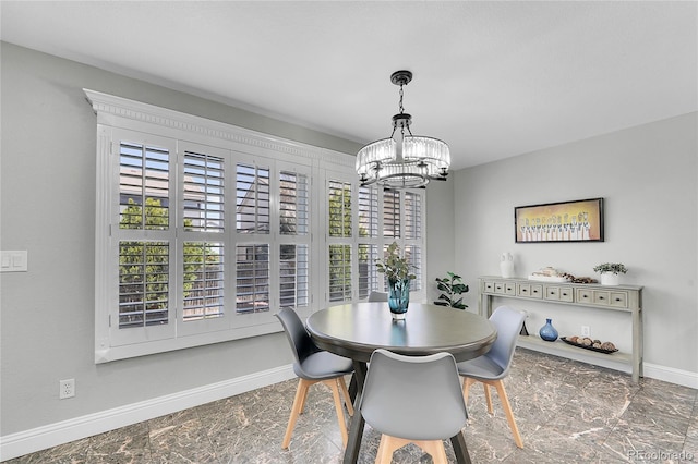 19731 E 40th Ave, Denver, CO 80249 - dining area with a chandelier and baseboards