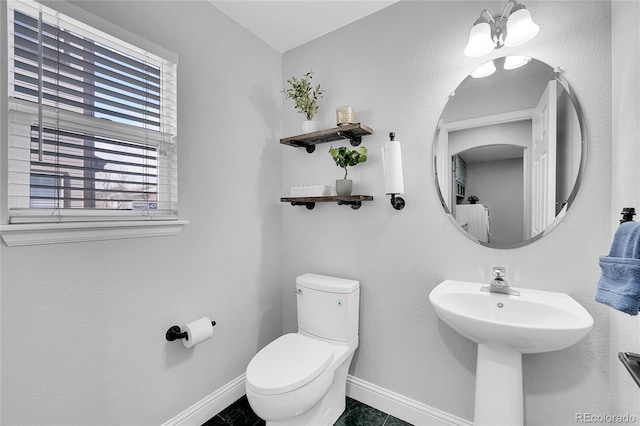 19731 E 40th Ave, Denver, CO 80249 - half bathroom featuring baseboards and toilet