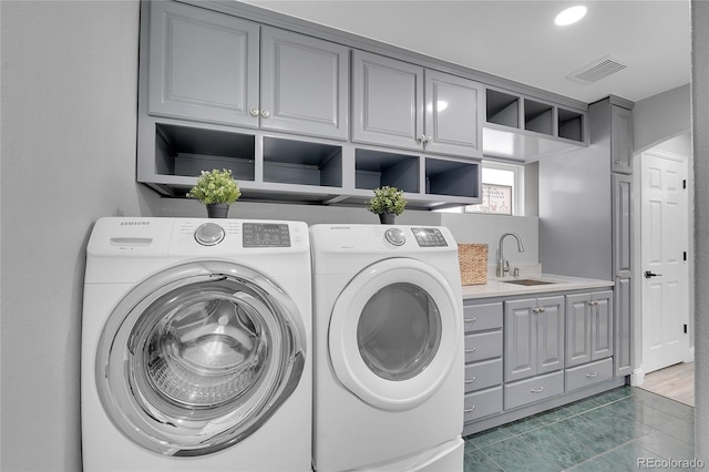 19731 E 40th Ave, Denver, CO 80249 - washroom with washer and dryer and cabinet space
