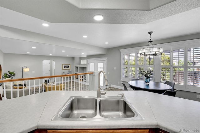 19731 E 40th Ave, Denver, CO 80249 - kitchen with recessed lighting, light countertops, and hanging light fixtures