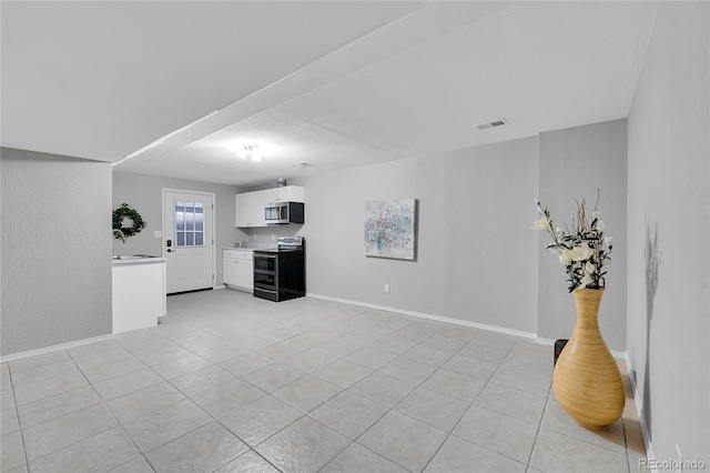 19731 E 40th Ave, Denver, CO 80249 - unfurnished living room with light tile patterned flooring