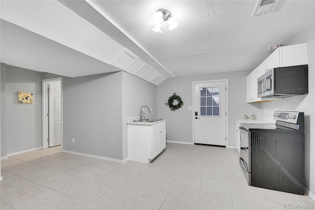 19731 E 40th Ave, Denver, CO 80249 - kitchen with stainless steel appliances, a textured ceiling, light countertops, and white cabinets
