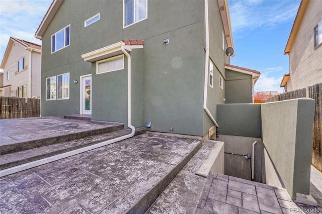 19731 E 40th Ave, Denver, CO 80249 - rear view of house with a patio area and stucco siding