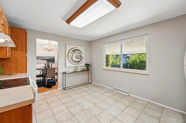 1905 S Linden Ct, Denver, CO 80224 - dining room with a chandelier and baseboards