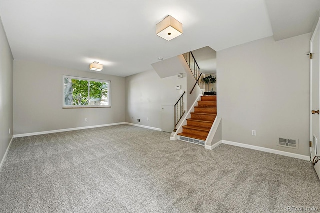 1905 S Linden Ct, Denver, CO 80224 - unfurnished living room with stairs and carpet floors