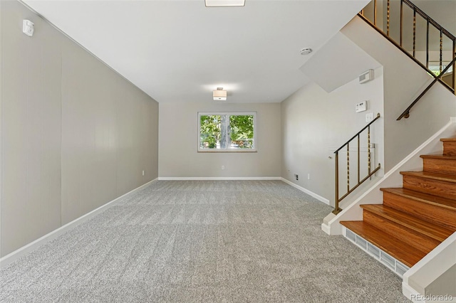 1905 S Linden Ct, Denver, CO 80224 - unfurnished living room with stairway and carpet floors