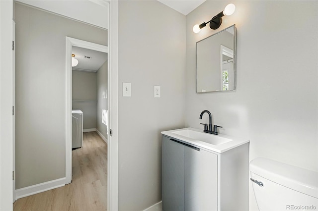 1905 S Linden Ct, Denver, CO 80224 - bathroom with wood finished floors and vanity
