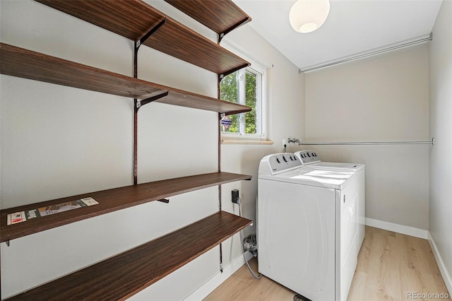 1905 S Linden Ct, Denver, CO 80224 - laundry room featuring washing machine and clothes dryer and light wood-type flooring