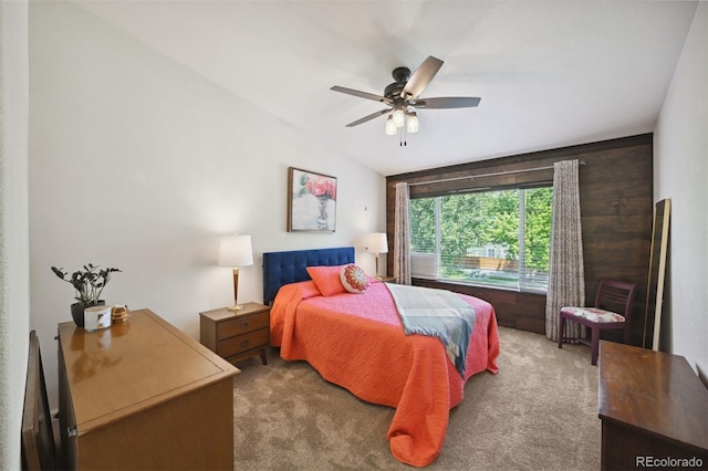 carpeted bedroom featuring ceiling fan and vaulted ceiling