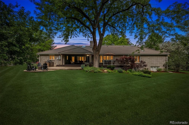5340 S Logan Dr, Greenwood Village, CO 80121 - rear view of house with a yard, a patio area, a chimney, and a tile roof