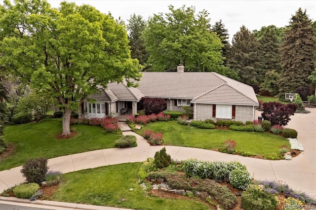 5340 S Logan Dr, Greenwood Village, CO 80121 - ranch-style house with a tiled roof, a front lawn, and a chimney