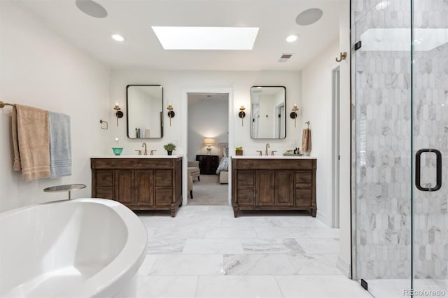 5340 S Logan Dr, Greenwood Village, CO 80121 - bathroom featuring a skylight, a bath, a marble finish shower, two vanities, and recessed lighting
