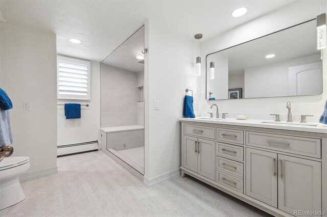 5340 S Logan Dr, Greenwood Village, CO 80121 - full bath with a baseboard heating unit, double vanity, baseboards, toilet, and recessed lighting