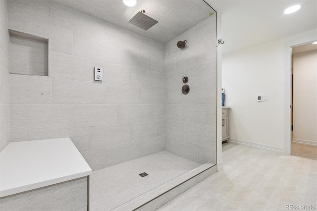 5340 S Logan Dr, Greenwood Village, CO 80121 - bathroom featuring a tile shower, recessed lighting, and baseboards