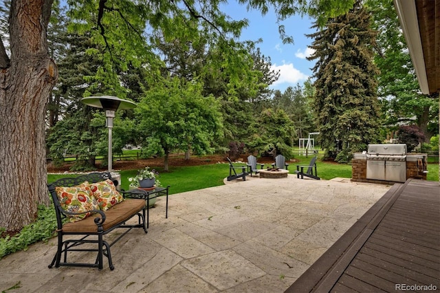 5340 S Logan Dr, Greenwood Village, CO 80121 - view of patio / terrace featuring an outdoor fire pit and view of wooded area